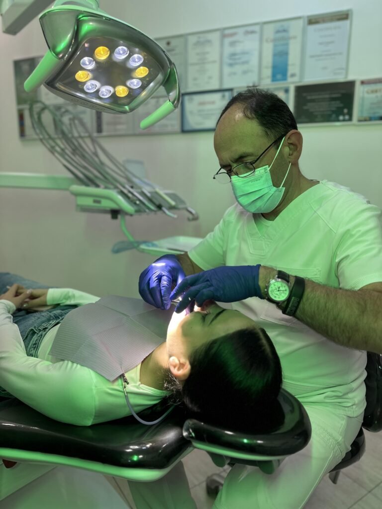 an orthodontist in a clinic with a patient