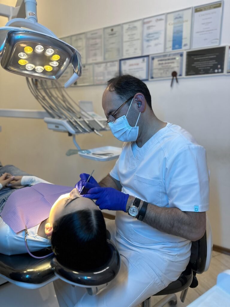an orthodontist in a clinic with a patient