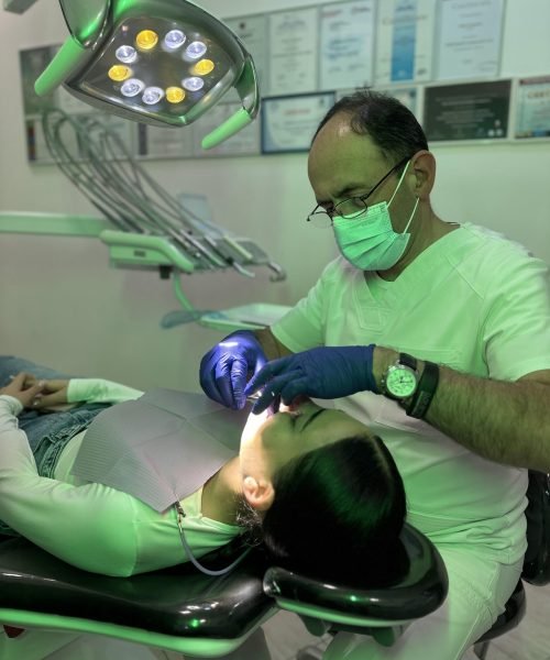 an orthodontist in a clinic with a patient
